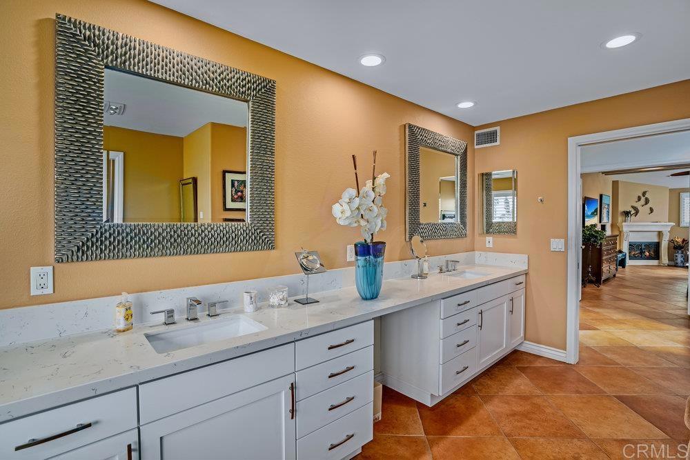 332 Gravilla Street La Jolla, CA 92037 - Photo 27 of 49 a spacious bathroom with a granite countertop sink mirror and bathtub