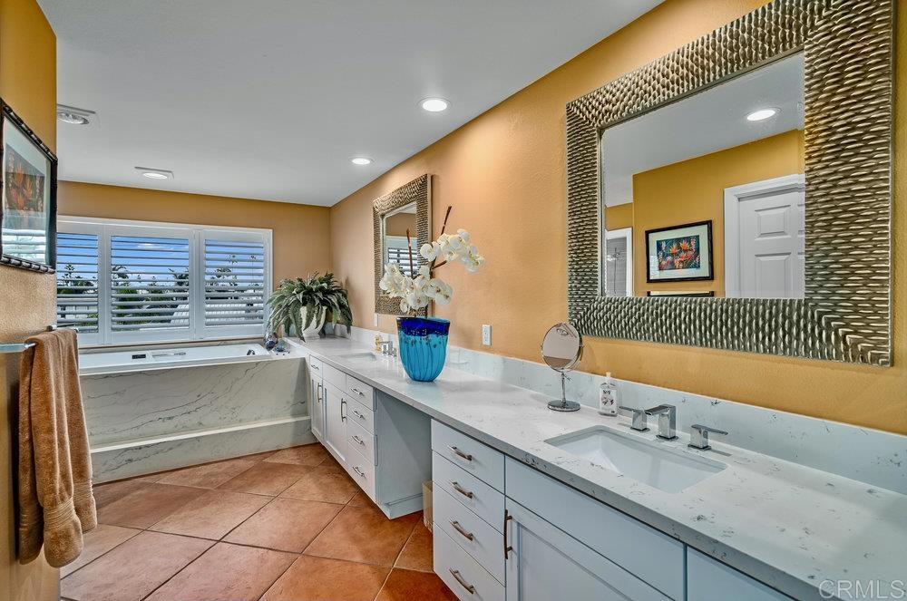 332 Gravilla Street La Jolla, CA 92037 - Photo 28 of 49 a bathroom with a sink and a mirror
