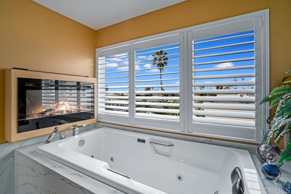 332 Gravilla Street La Jolla, CA 92037 - Photo 29 of 49 a bathroom with a tub and a sink