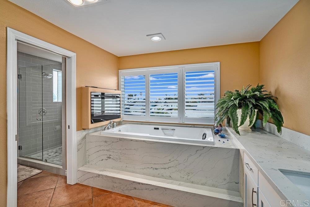 332 Gravilla Street La Jolla, CA 92037 - Photo 30 of 49 a bathroom with a sink and a bathtub