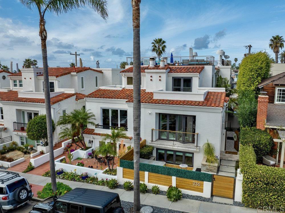 332 Gravilla Street La Jolla, CA 92037 - Photo 37 of 49 a front view of house with yard garage and outdoor seating