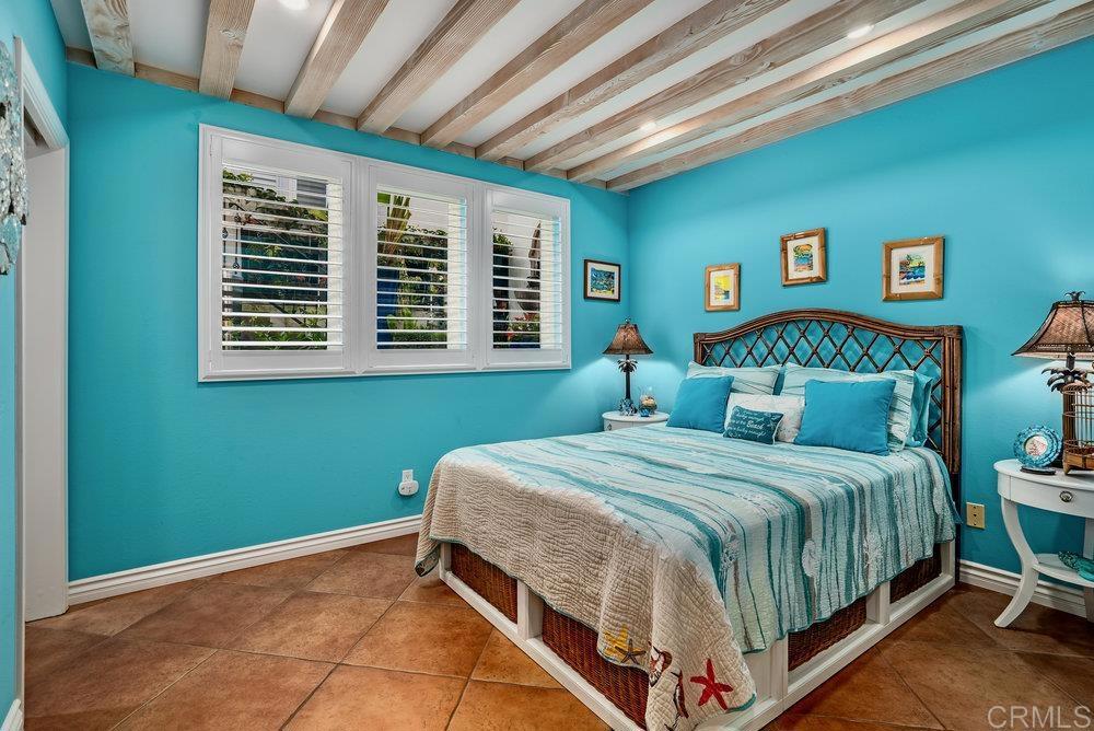332 Gravilla Street La Jolla, CA 92037 - Photo 43 of 49 a bedroom with a bed and a window
