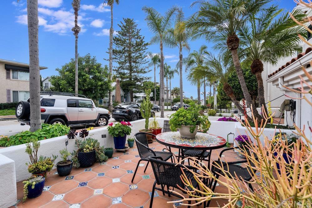 332 Gravilla Street La Jolla, CA 92037 - Photo 5 of 49 a backyard of a house with a table and chairs