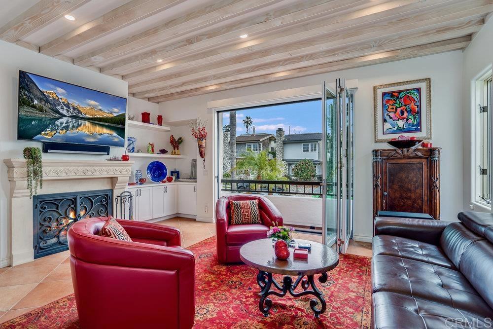 332 Gravilla Street La Jolla, CA 92037 - Photo 8 of 49 a living room with furniture and a flat screen tv