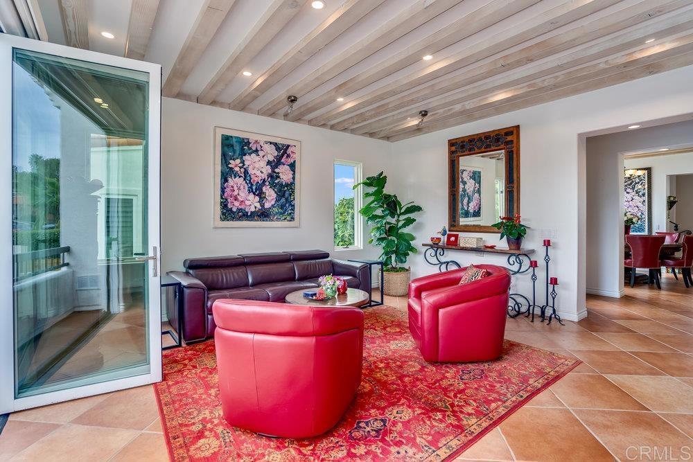 332 Gravilla Street La Jolla, CA 92037 - Photo 9 of 49 a living room with furniture a rug and a potted plant