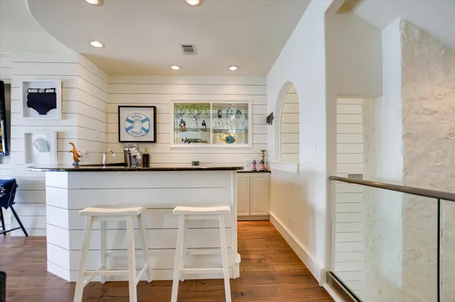 a bathroom with a sink and a large mirror