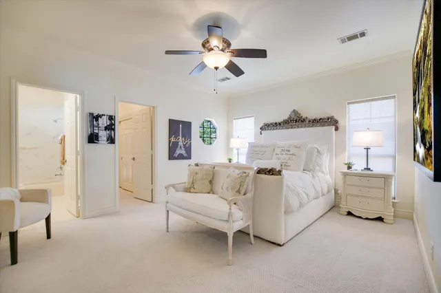 a bed room with a bed and a chandelier