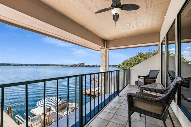 a view of a balcony with furniture