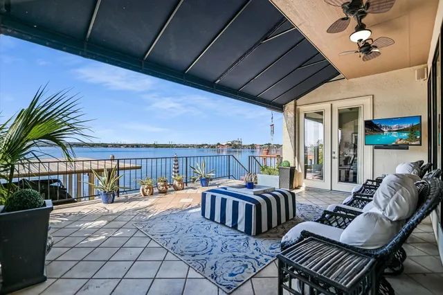 a front view of a house with outdoor seating