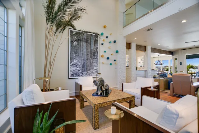a view of a dining room with furniture and a potted plant