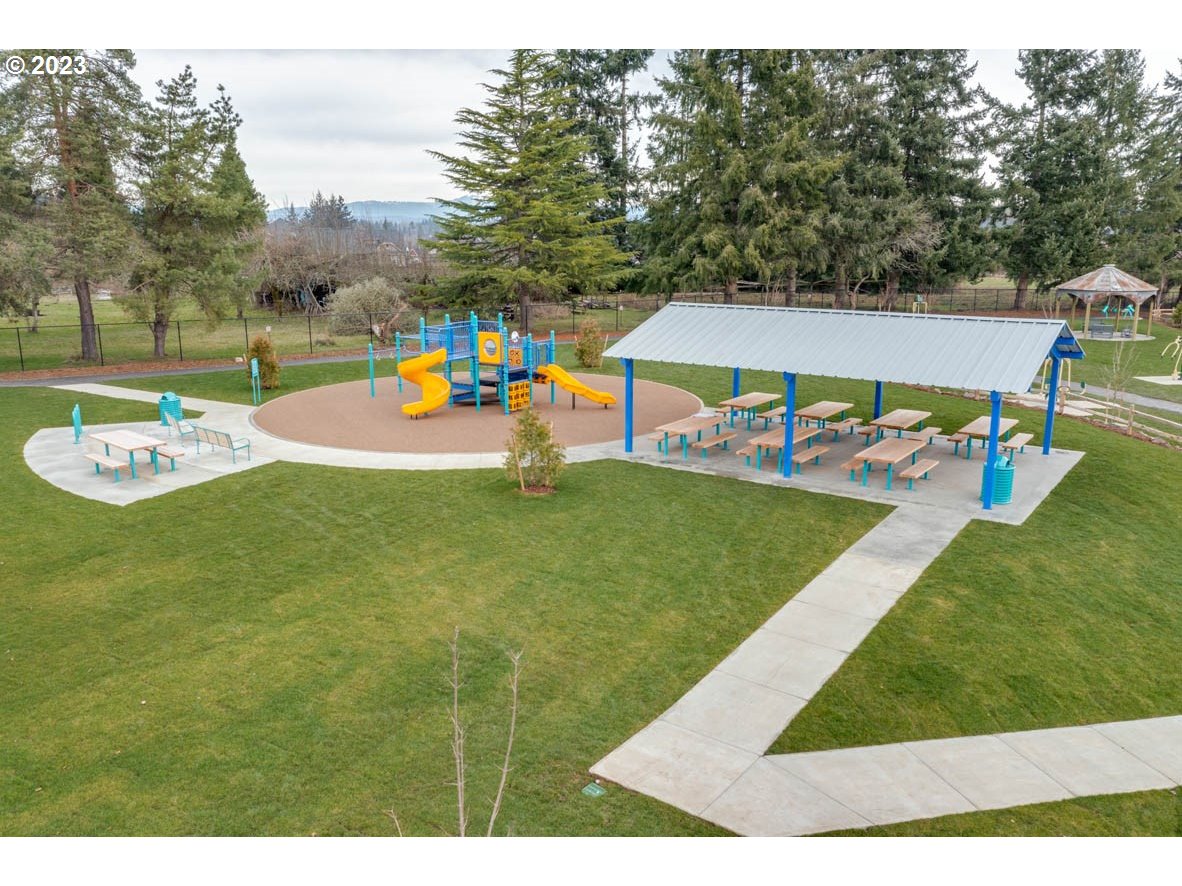 255 North Layla Place Ridgefield, WA 98642 - Photo 25 of 27 a view of a swimming pool with an outdoor space and seating area