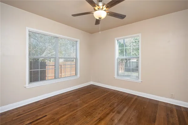 a bathroom with a shower a toilet and a sink