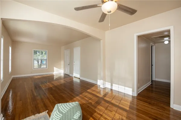 a view of livingroom with hardwood floor and ceiling fan