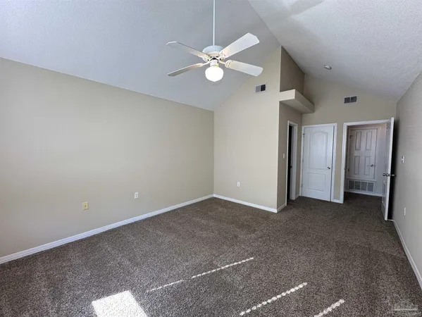 a view of a balcony with wooden floor and fence