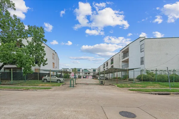 a view of street with parked cars