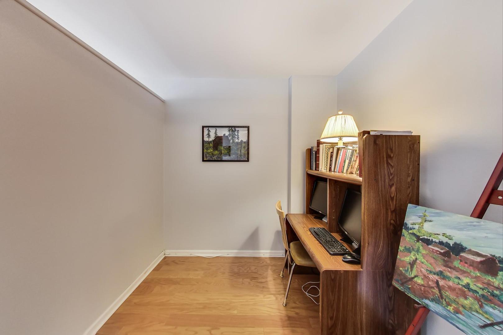 2930 North Sheridan Road, Unit 802 Chicago, IL 60657 - Photo 11 of 30 a view of an empty room with furniture and a fireplace