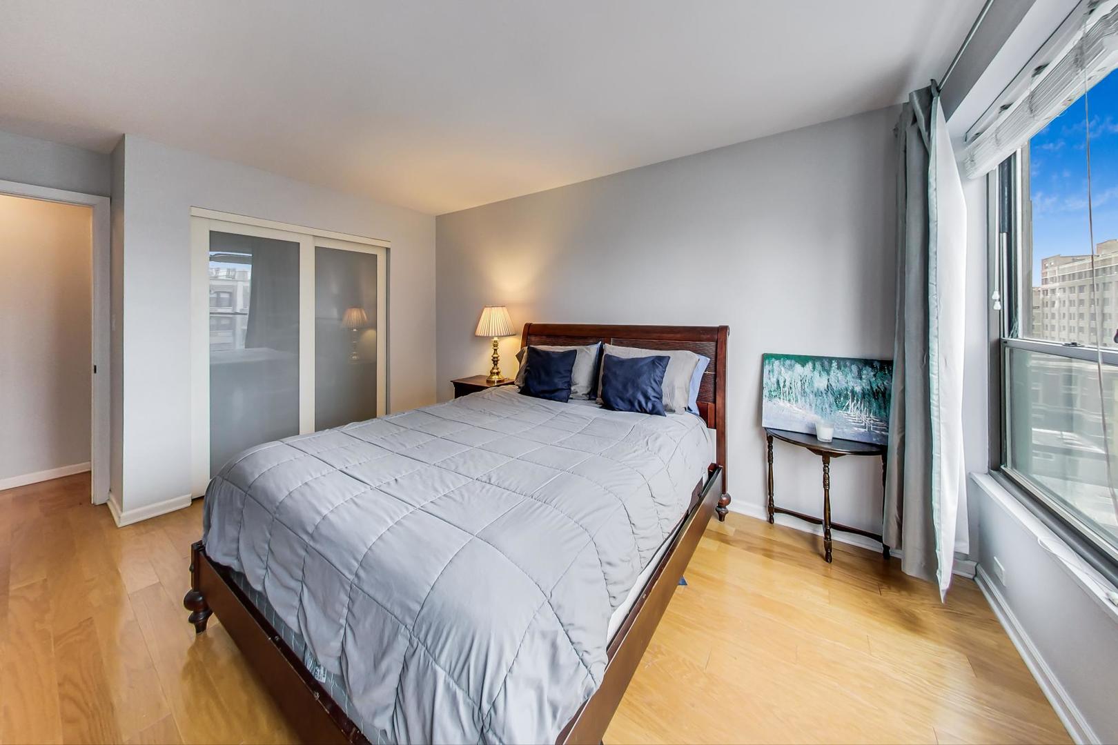2930 North Sheridan Road, Unit 802 Chicago, IL 60657 - Photo 14 of 30 a bedroom with a bed and a window