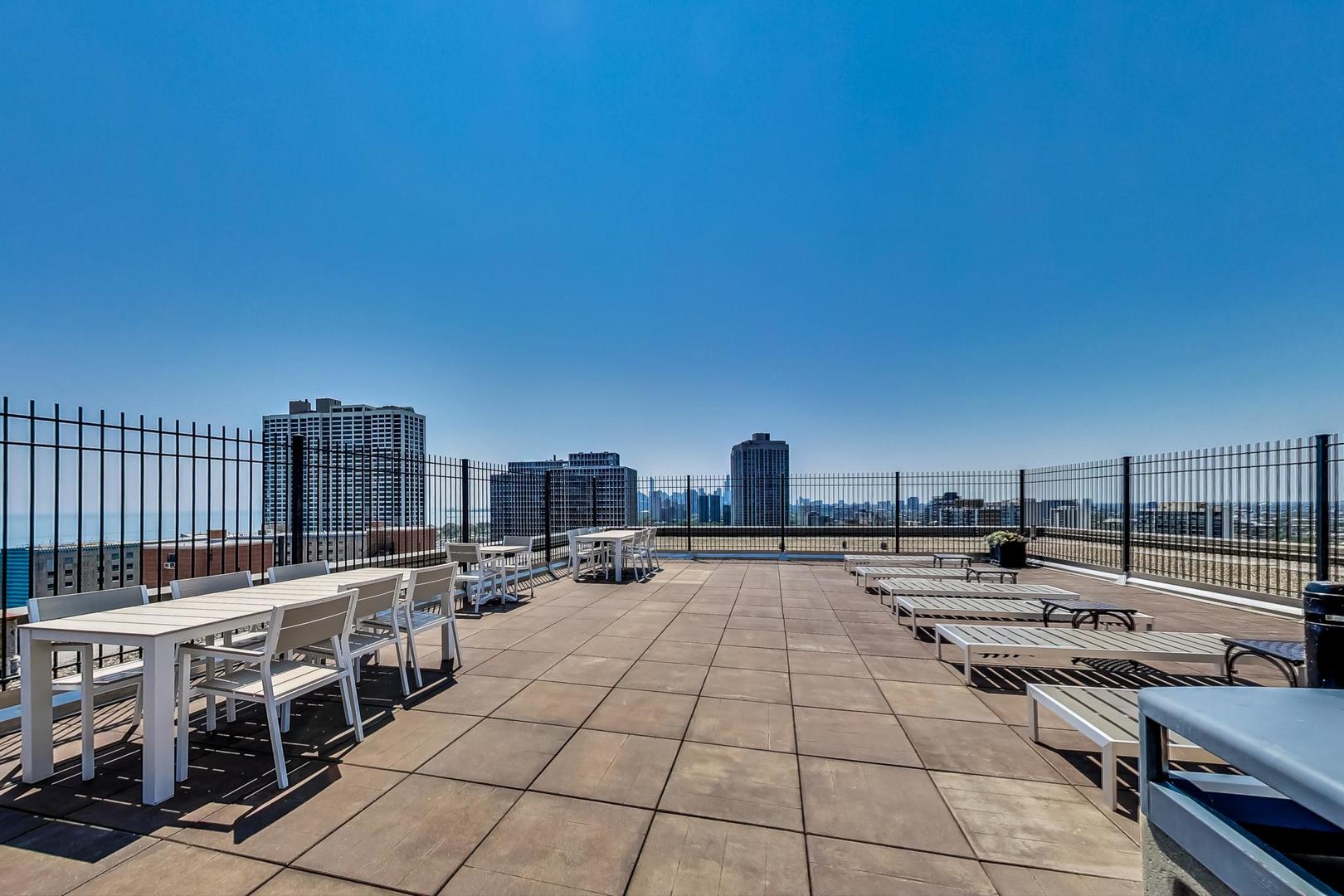 2930 North Sheridan Road, Unit 802 Chicago, IL 60657 - Photo 20 of 30 a view of a terrace with chairs
