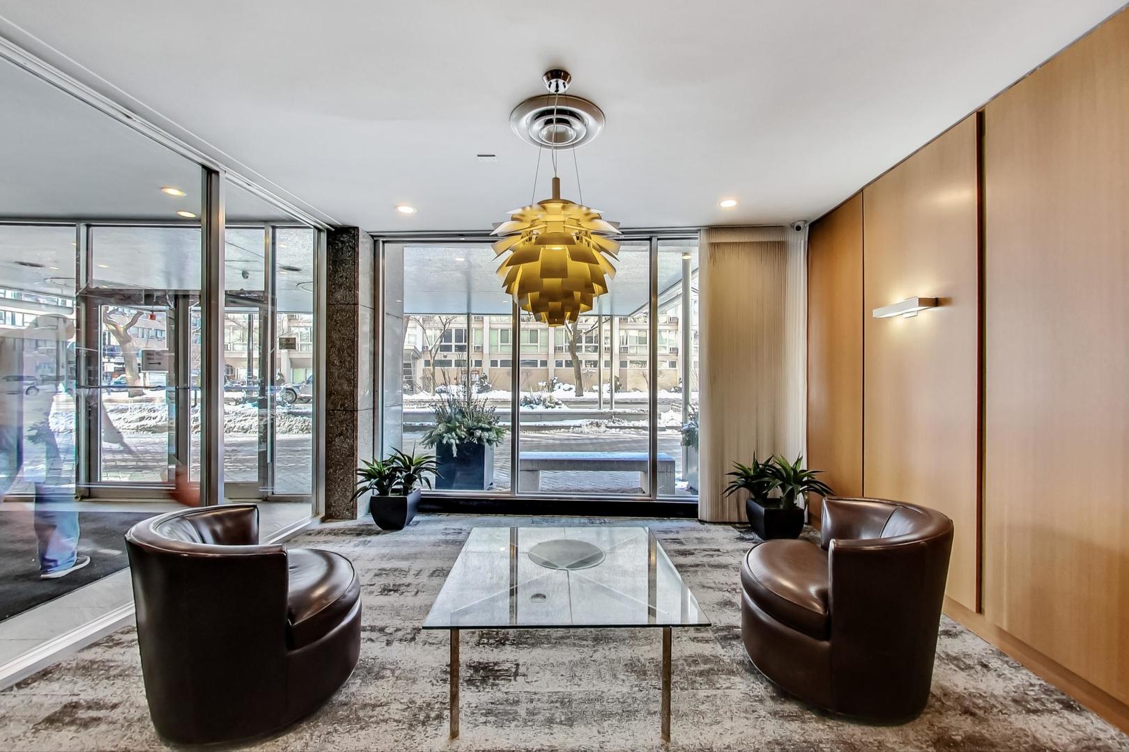 2930 North Sheridan Road, Unit 802 Chicago, IL 60657 - Photo 26 of 30 a living room with furniture and a large window