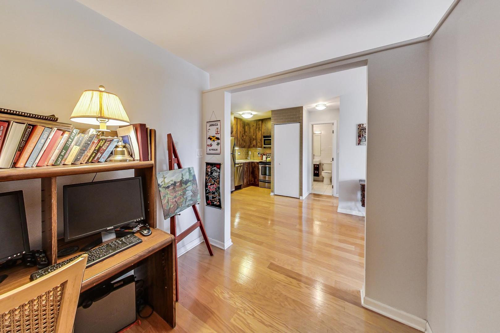 2930 North Sheridan Road, Unit 802 Chicago, IL 60657 - Photo 10 of 30 a living room with furniture and a flat screen tv