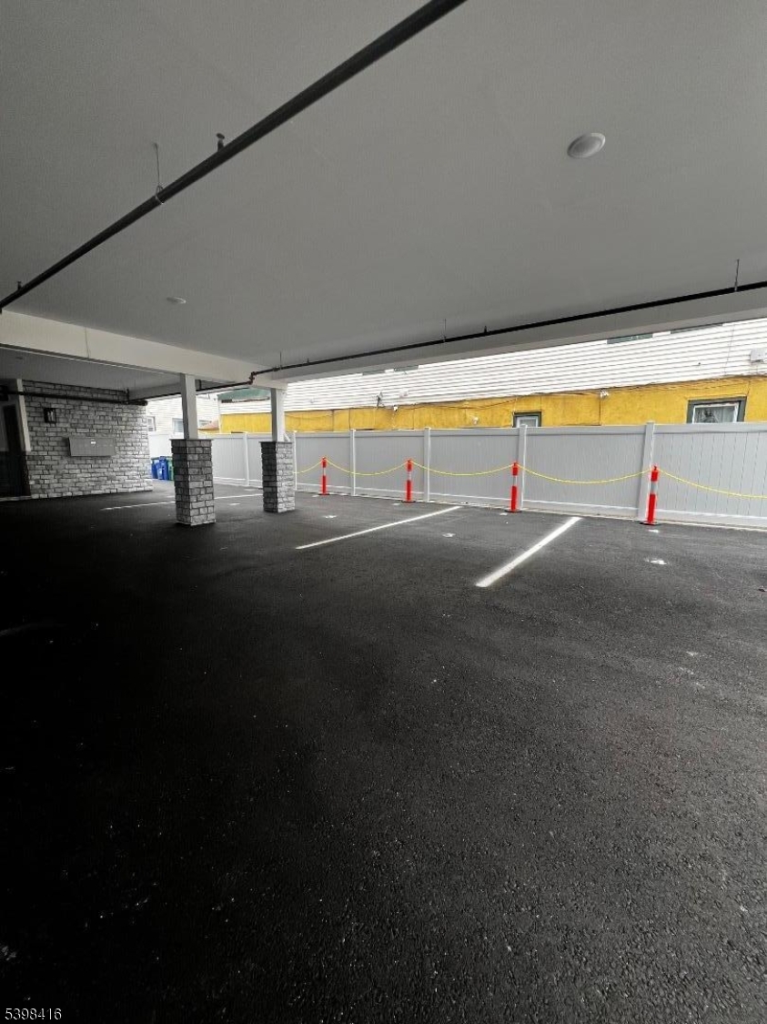 110 Madison Street, Unit 2 Passaic, NJ 07055 - Photo 8 of 8 a view of an empty room with a window