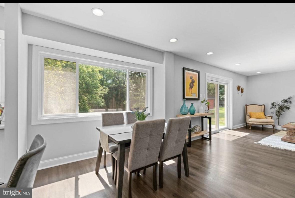 9802 Cherry Tree Lane Silver Spring, MD 20901 - Photo 11 of 33 a view of a dining room with furniture and wooden floor