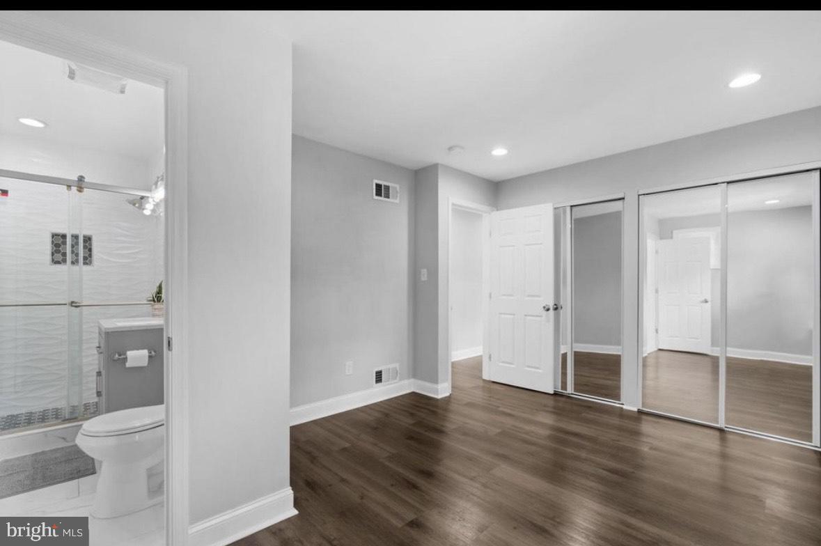 9802 Cherry Tree Lane Silver Spring, MD 20901 - Photo 17 of 33 a bathroom with a shower and a toilet