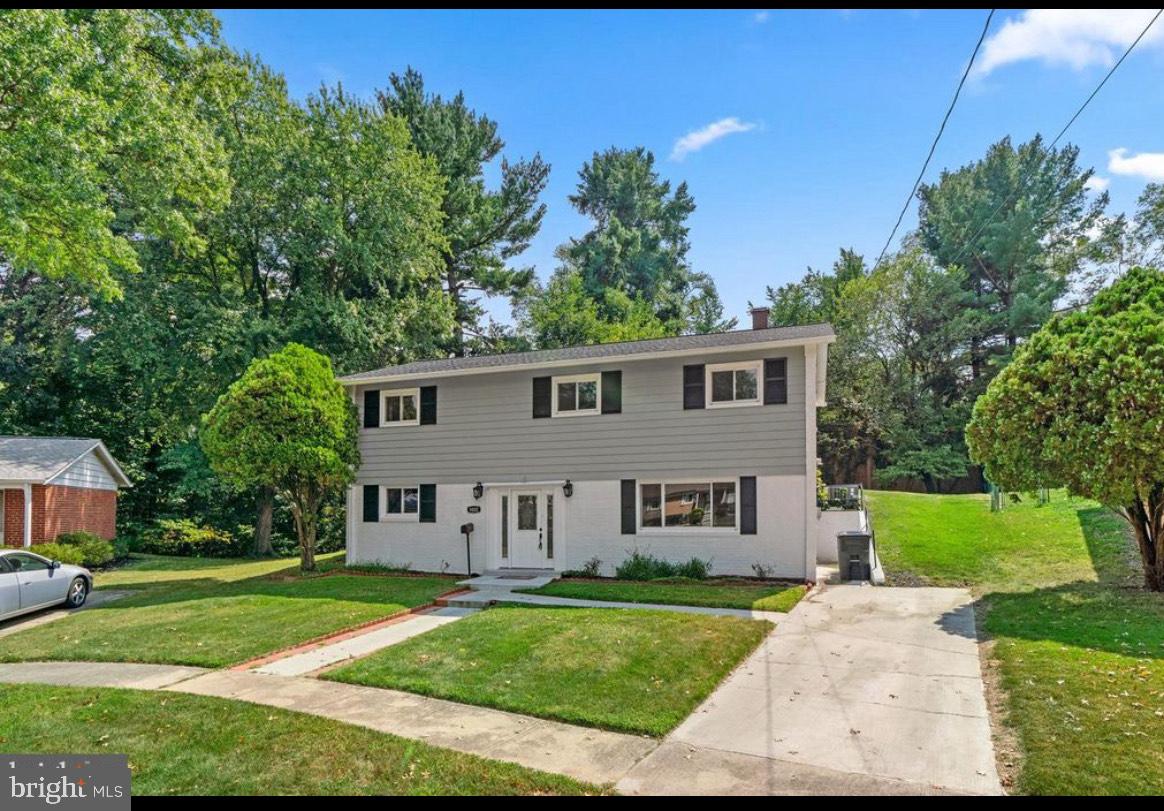 9802 Cherry Tree Lane Silver Spring, MD 20901 - Photo 2 of 33 front view of a house with a yard