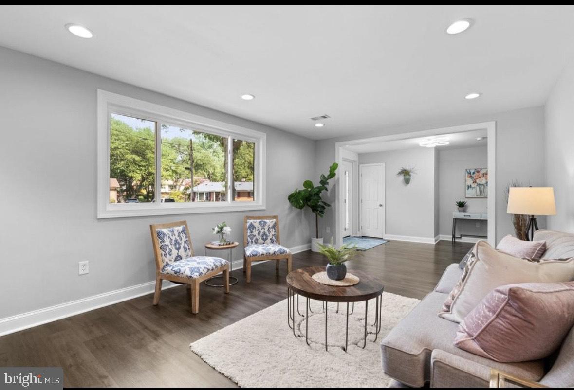 9802 Cherry Tree Lane Silver Spring, MD 20901 - Photo 23 of 33 a living room with furniture and a large window