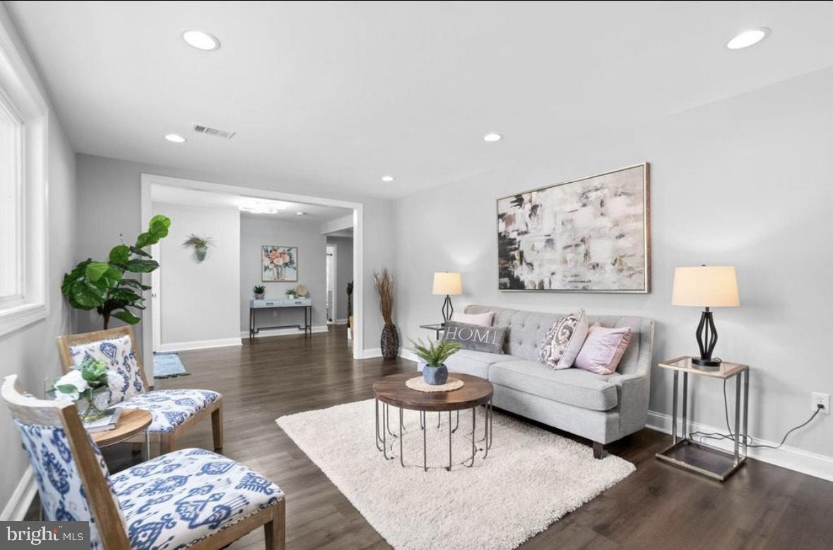 9802 Cherry Tree Lane Silver Spring, MD 20901 - Photo 24 of 33 a living room with furniture and wooden floor