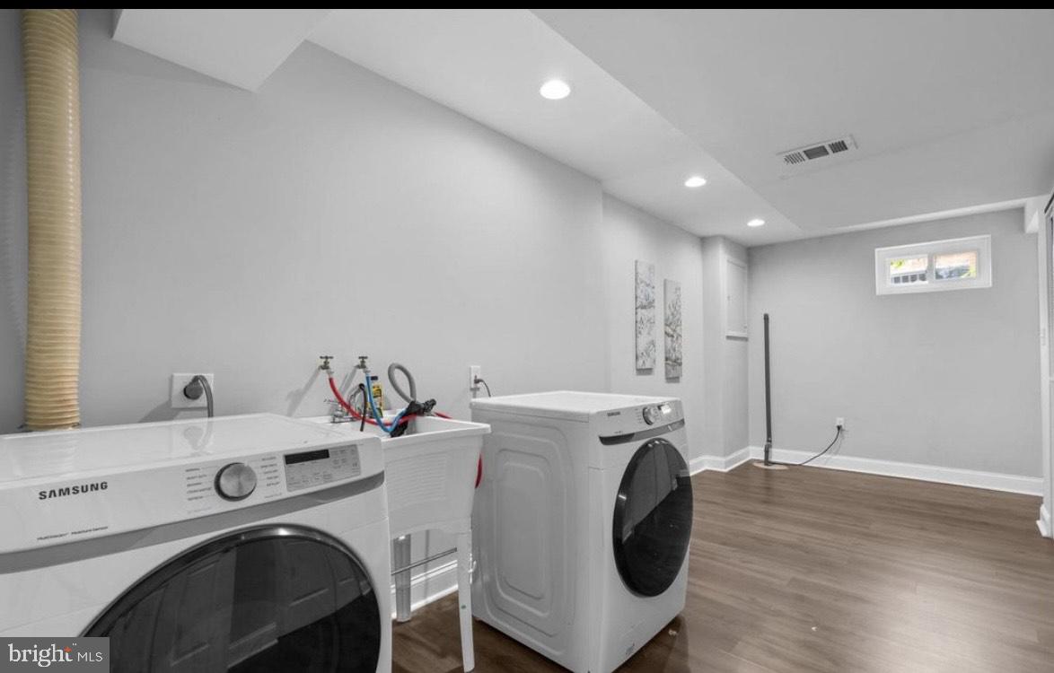 9802 Cherry Tree Lane Silver Spring, MD 20901 - Photo 27 of 33 a view of a kitchen with sink washer and dryer