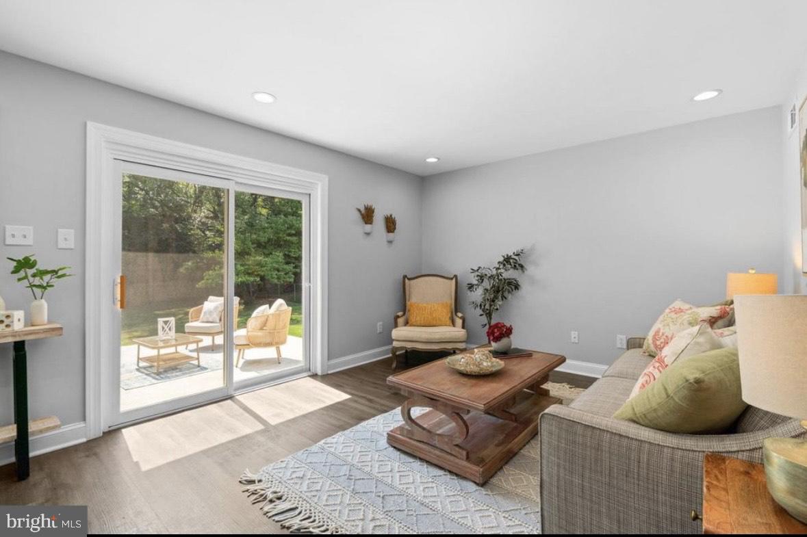 9802 Cherry Tree Lane Silver Spring, MD 20901 - Photo 3 of 33 a living room with furniture and a window
