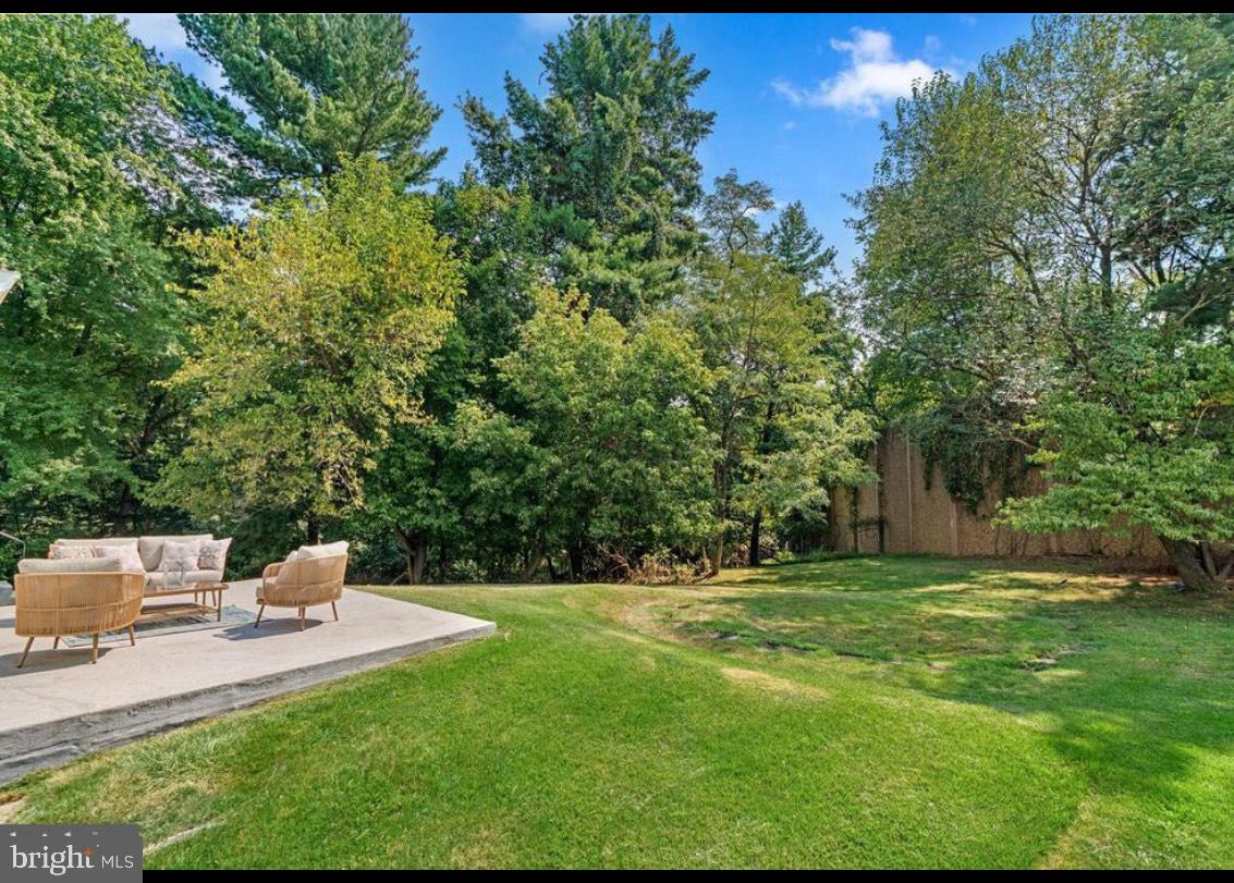 9802 Cherry Tree Lane Silver Spring, MD 20901 - Photo 31 of 33 a view of a table and chairs in the garden