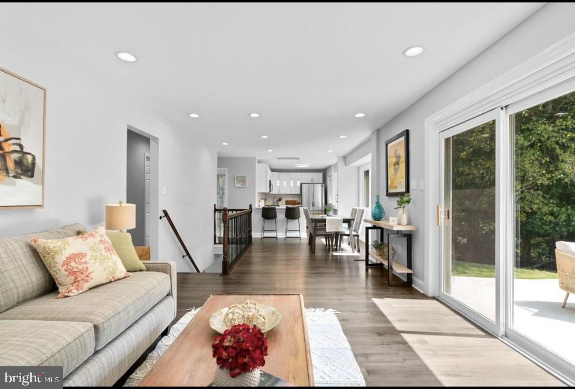 9802 Cherry Tree Lane Silver Spring, MD 20901 - Photo 9 of 33 a living room with furniture and a potted plant