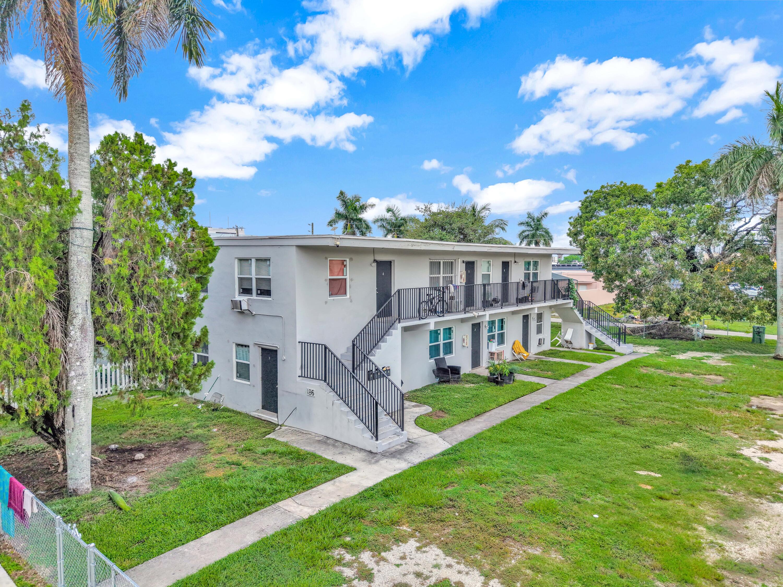 186 Northwest 1st Street Homestead, FL 33030 - Photo 2 of 8 a view of a house with a yard and sitting area