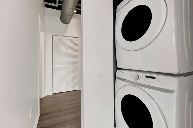 a close view of a utility room with dryer and washer