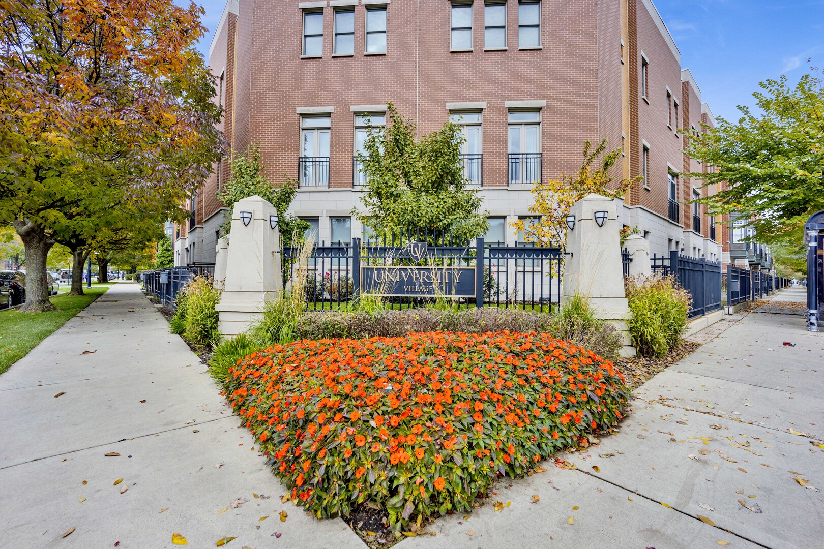 1524 South Sangamon Street, Unit 401 Chicago, IL 60608 - Photo 43 of 55 a view of a house with a small yard plants and large tree
