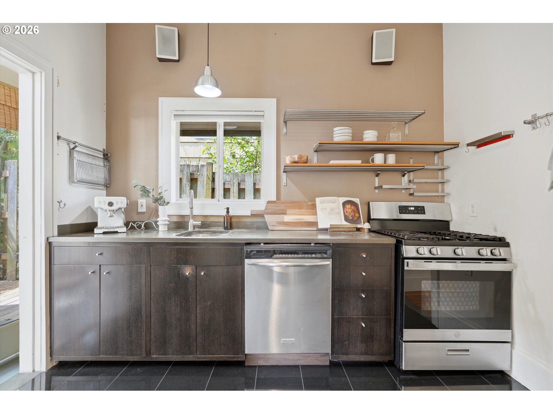 0322 Southwest Whitaker Street Portland, OR 97239 - Photo 15 of 39 a kitchen with a stove and a sink