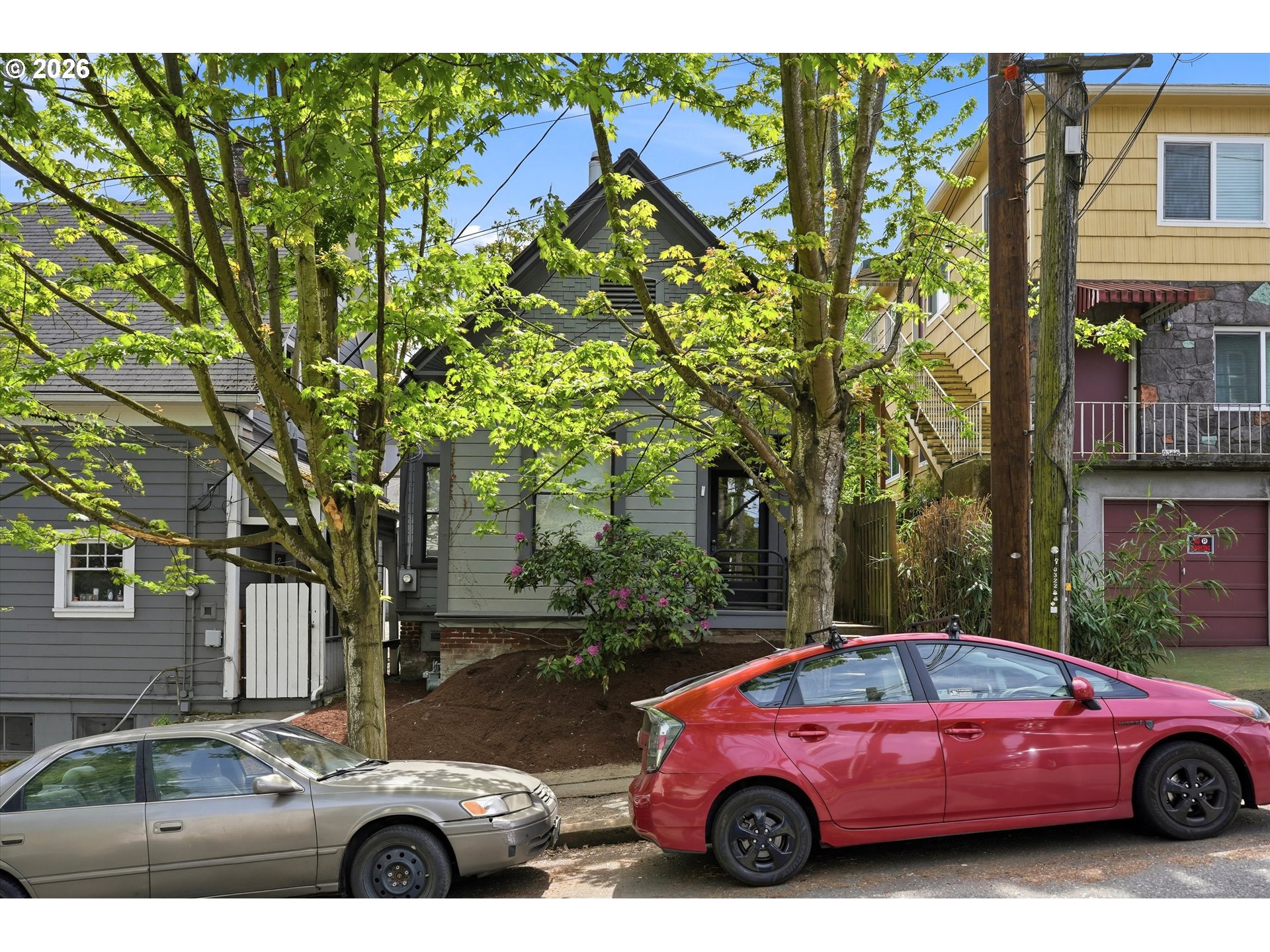 0322 Southwest Whitaker Street Portland, OR 97239 - Photo 3 of 39 a view of a car parked in front of a house