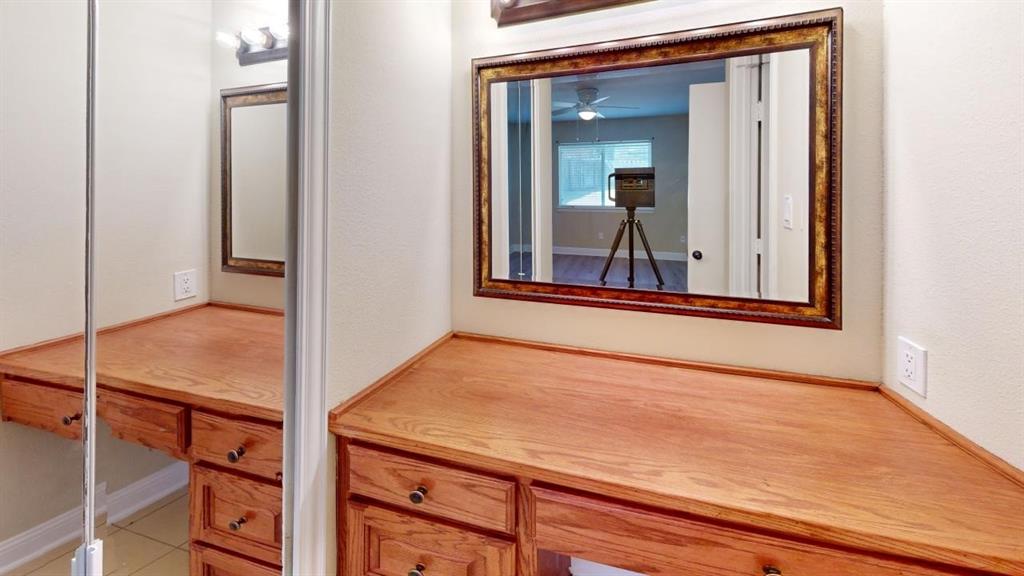 3005 Meandering Way Bedford, TX 76021 - Photo 18 of 22 a view of a room that has a large mirror on a dresser