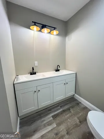 a bathroom with a sink and a toilet