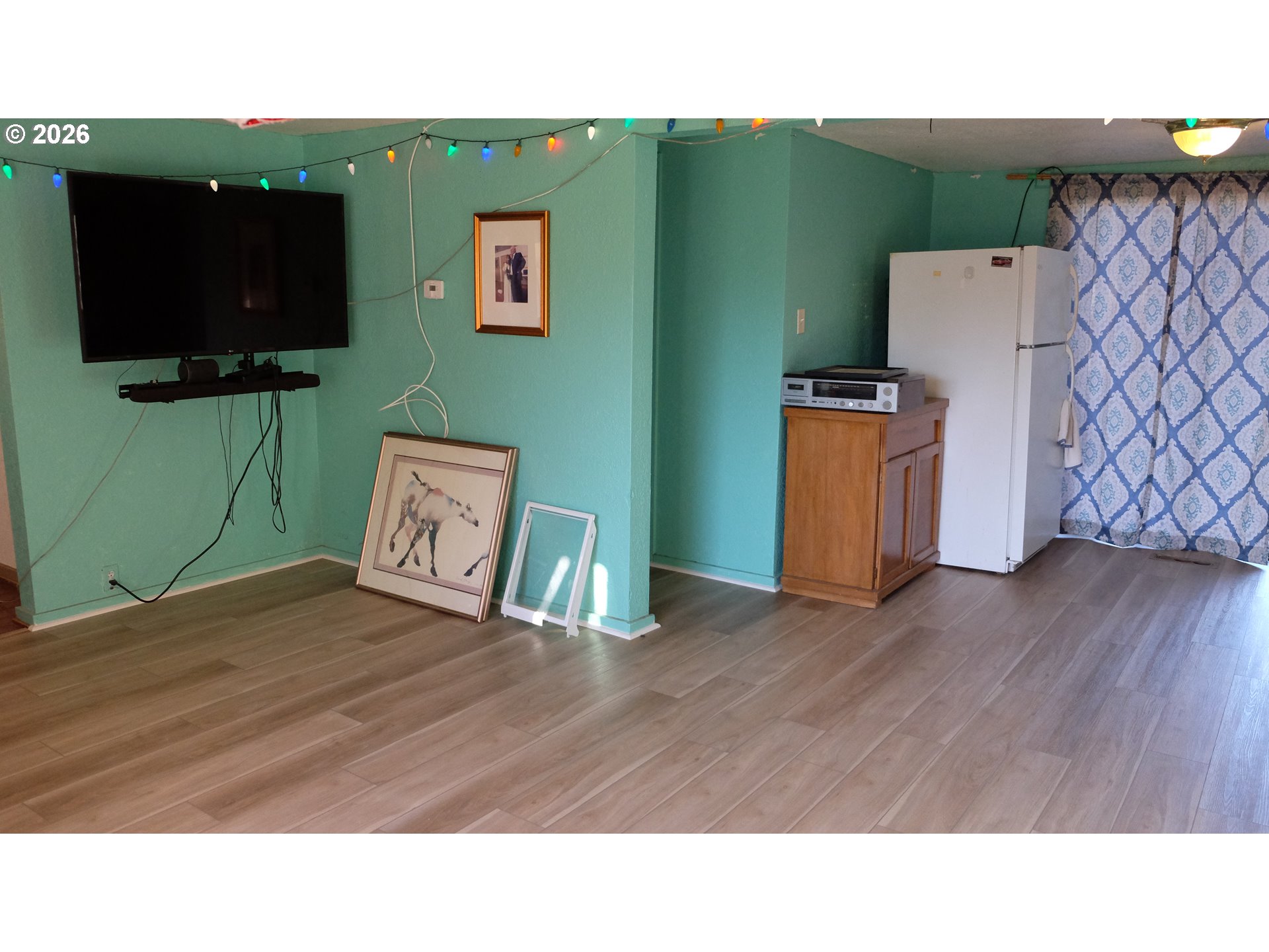 804 West N Street Springfield, OR 97477 - Photo 10 of 14 a living room with furniture and a flat screen tv