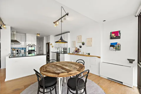 a kitchen with a table and chairs in it