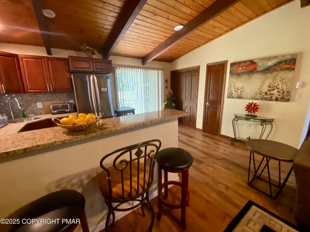 a living room with a bed furniture and a window
