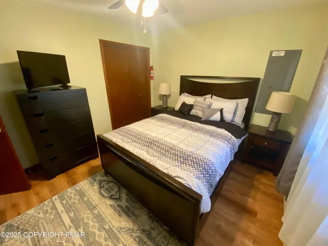 a bedroom with a bed and a window