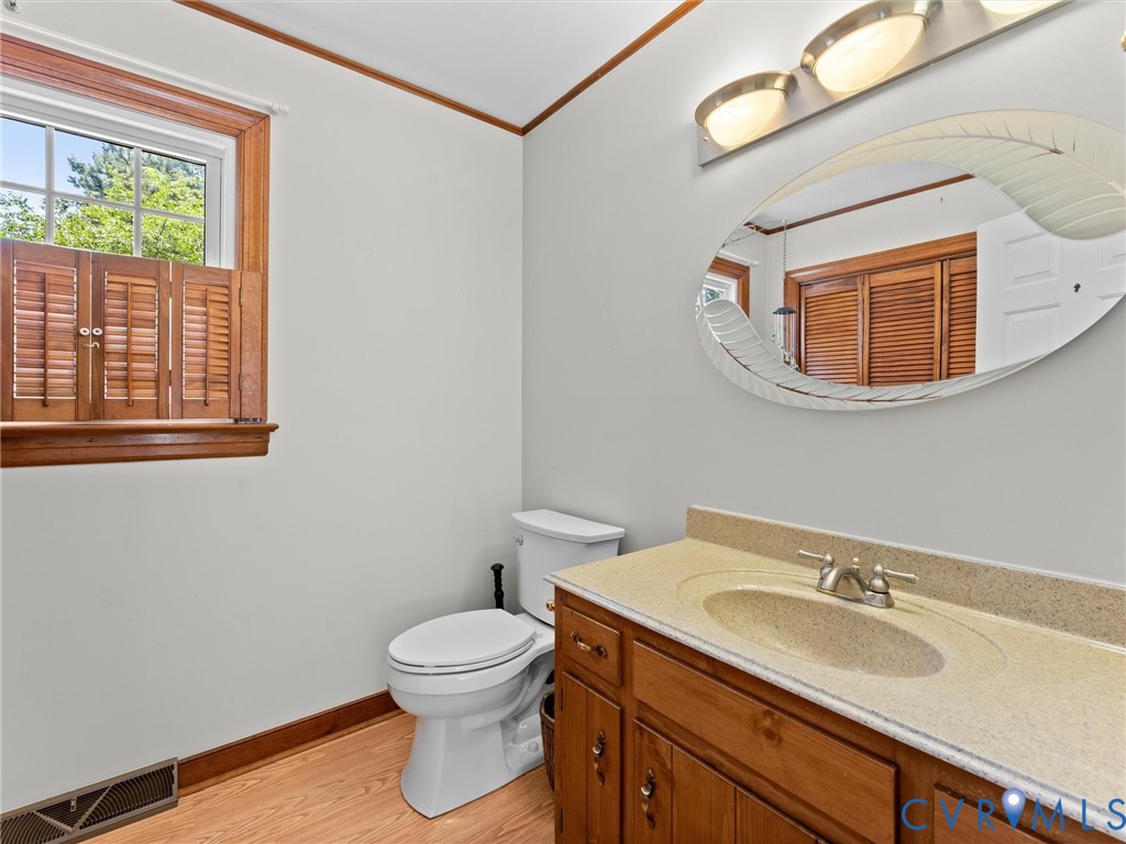 3524 Ludgate Road Chester, VA 23831 - Photo 19 of 44 Bathroom featuring a wood-finish vanity with a bui