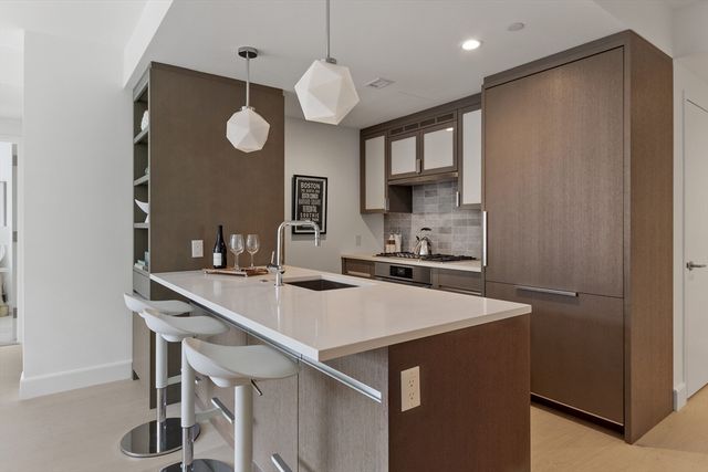 a kitchen with a table and chairs in it
