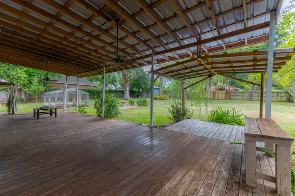 a view of a backyard with wooden floor