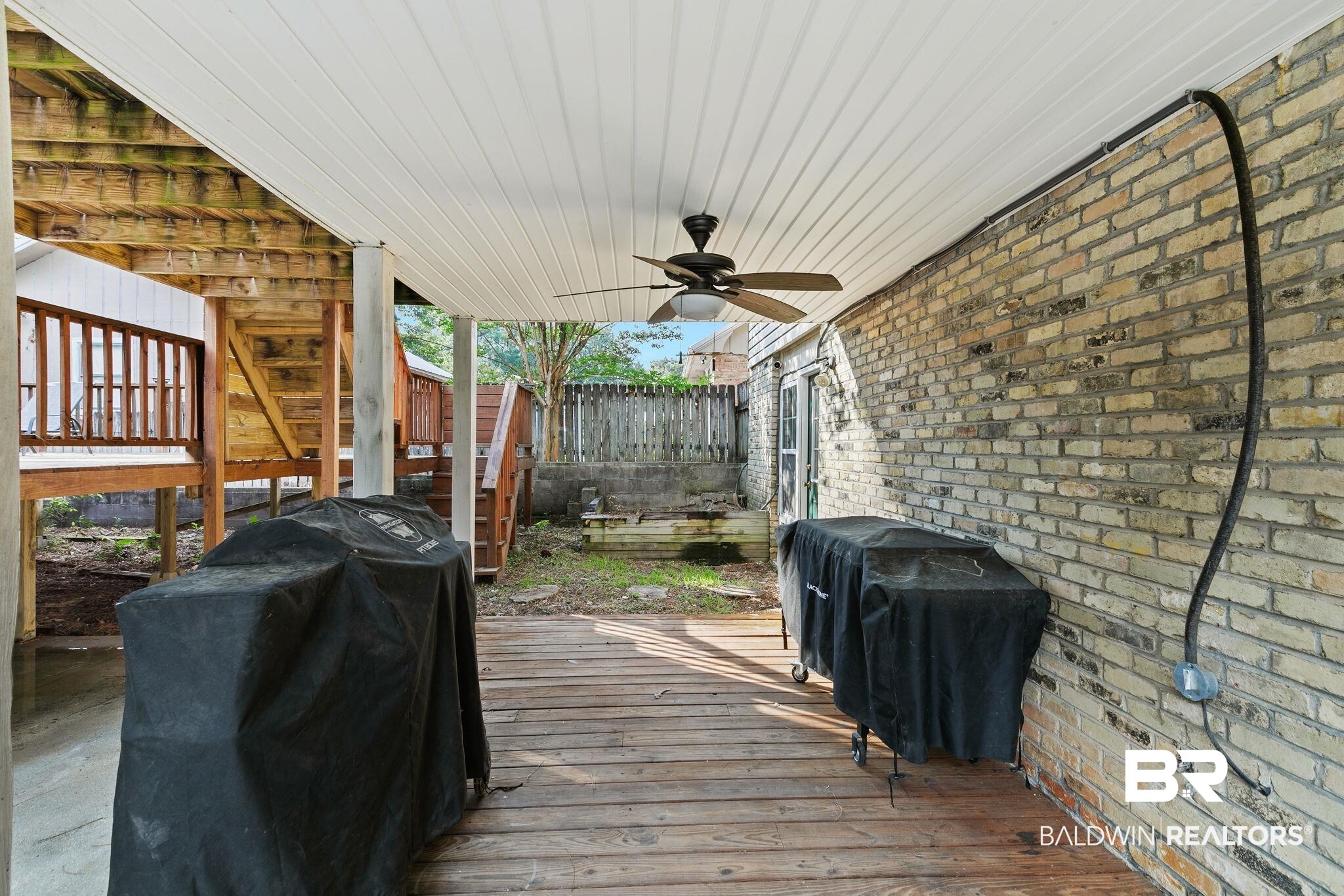 14 Lee Circle Daphne, AL 36527 - Photo 69 of 83 Wooden deck featuring a grill and ceiling fan