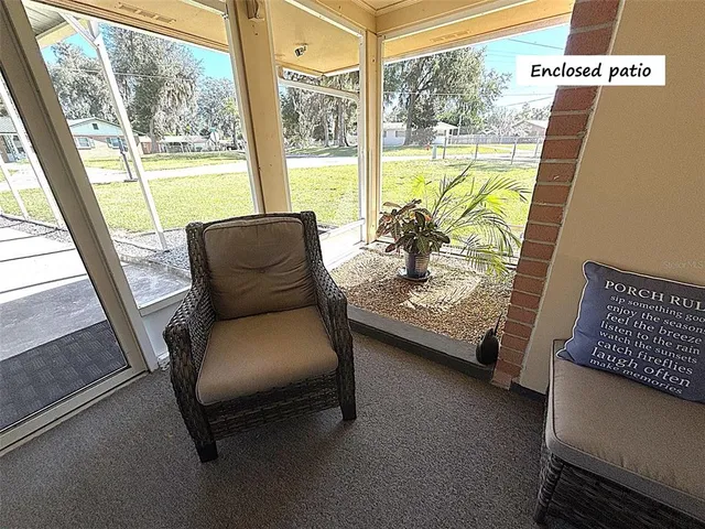 a view of a living room with furniture and a gate
